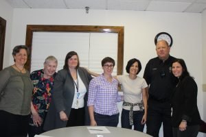 Members of the WAALL CCR Team. L-R: April Evans, Springwell Protective Services, Pat Cooper, REACH Elder Services Project Coordinator; Erin Miller, Newton-Wellesley Hospital DV/SA Program Coordinator; Lauren Montanaro, REACH Community Engagement Specialist; Maria Pizzimenti, REACH Director of Advocacy; Jon Bailey, Waltham Police Department TRIAD Officer; Heidi Gosule, Middlesex District Attorney Office Elder & Disabled Senior Prosecutor.