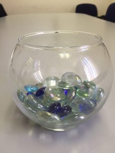 Each "pebble" in this jar represents a hopeful wish from a new volunteer or staff member who participated in the training.
