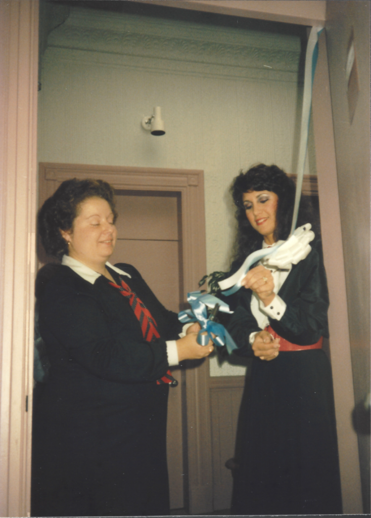Robin Braverman
and Paula Screnci-Vacaro, REACH founders, cutting the ribbon at the first shelter in 1981.