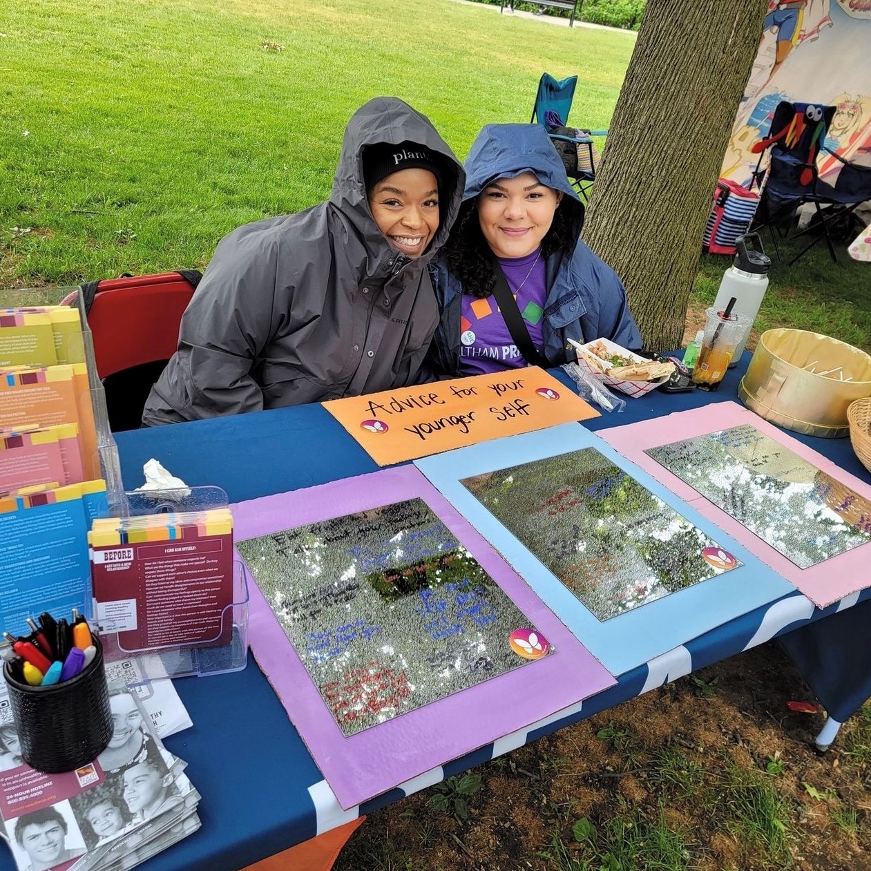Image of Sydney and Shanice tabling at Waltham Pride Festival 2023.