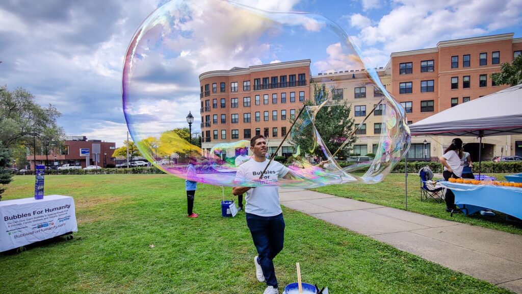 A Bubbles for Humanity volunteer at the 2024 REACH Fall Festival.